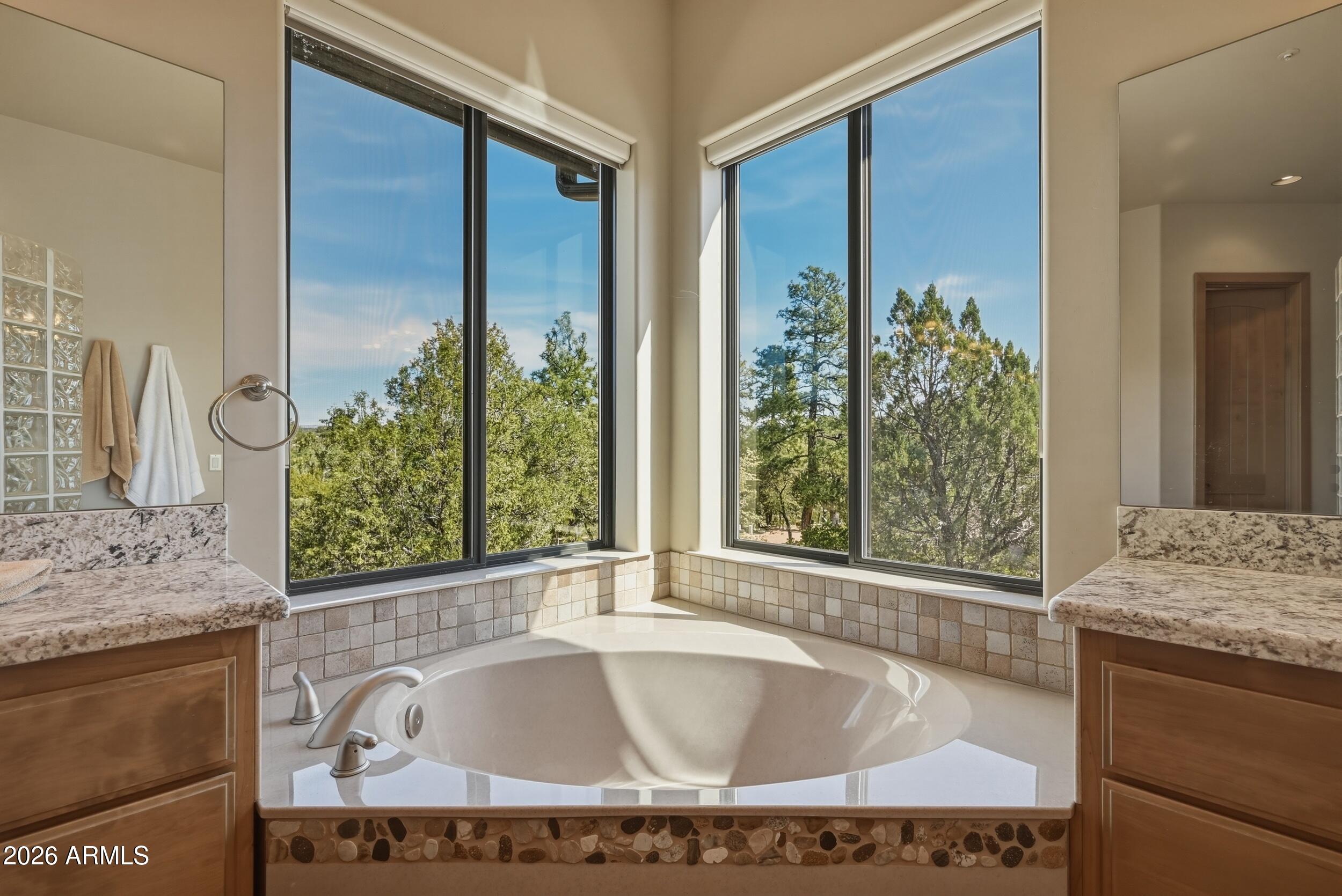 3101 East Mayfield Payson, AZ 85541 - Photo 32 of 71 a bathroom with a granite countertop tub sink and mirror