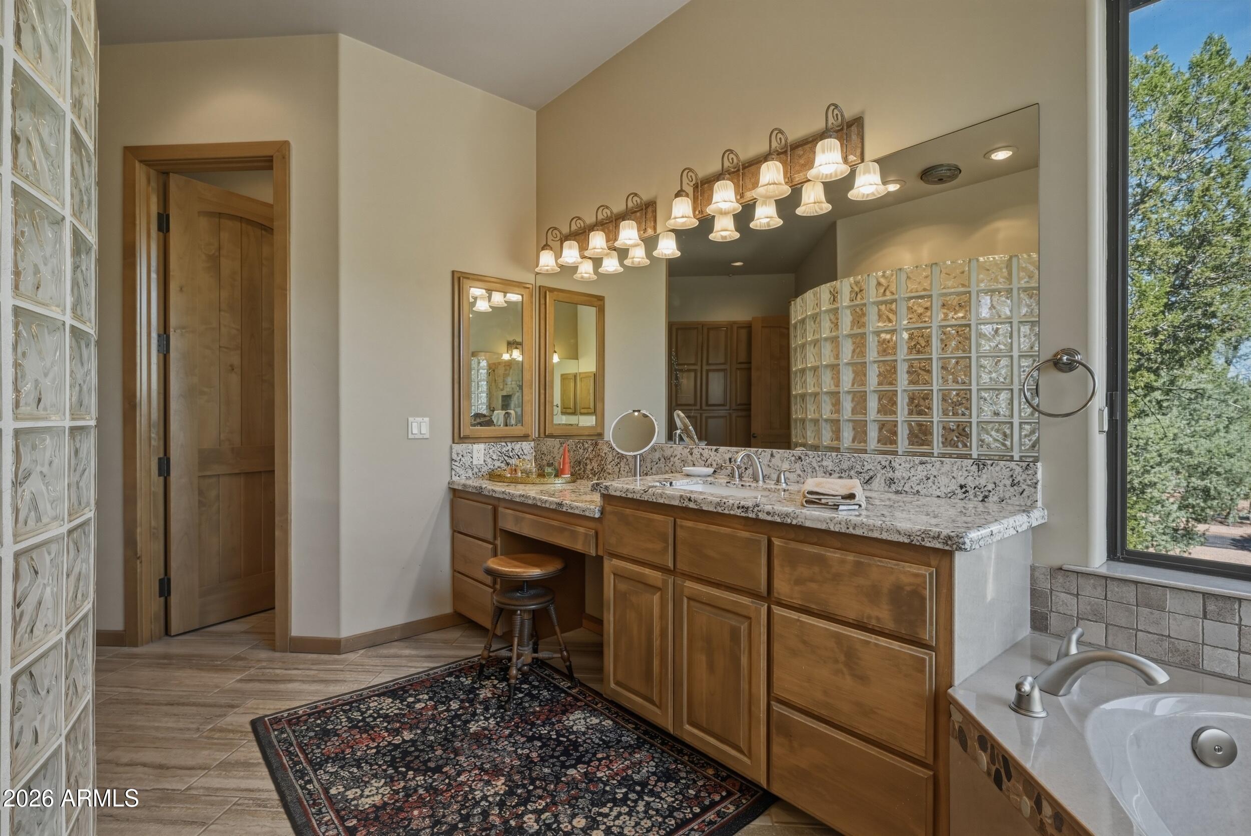 3101 East Mayfield Payson, AZ 85541 - Photo 33 of 71 a bathroom with a sink double vanity and a mirror