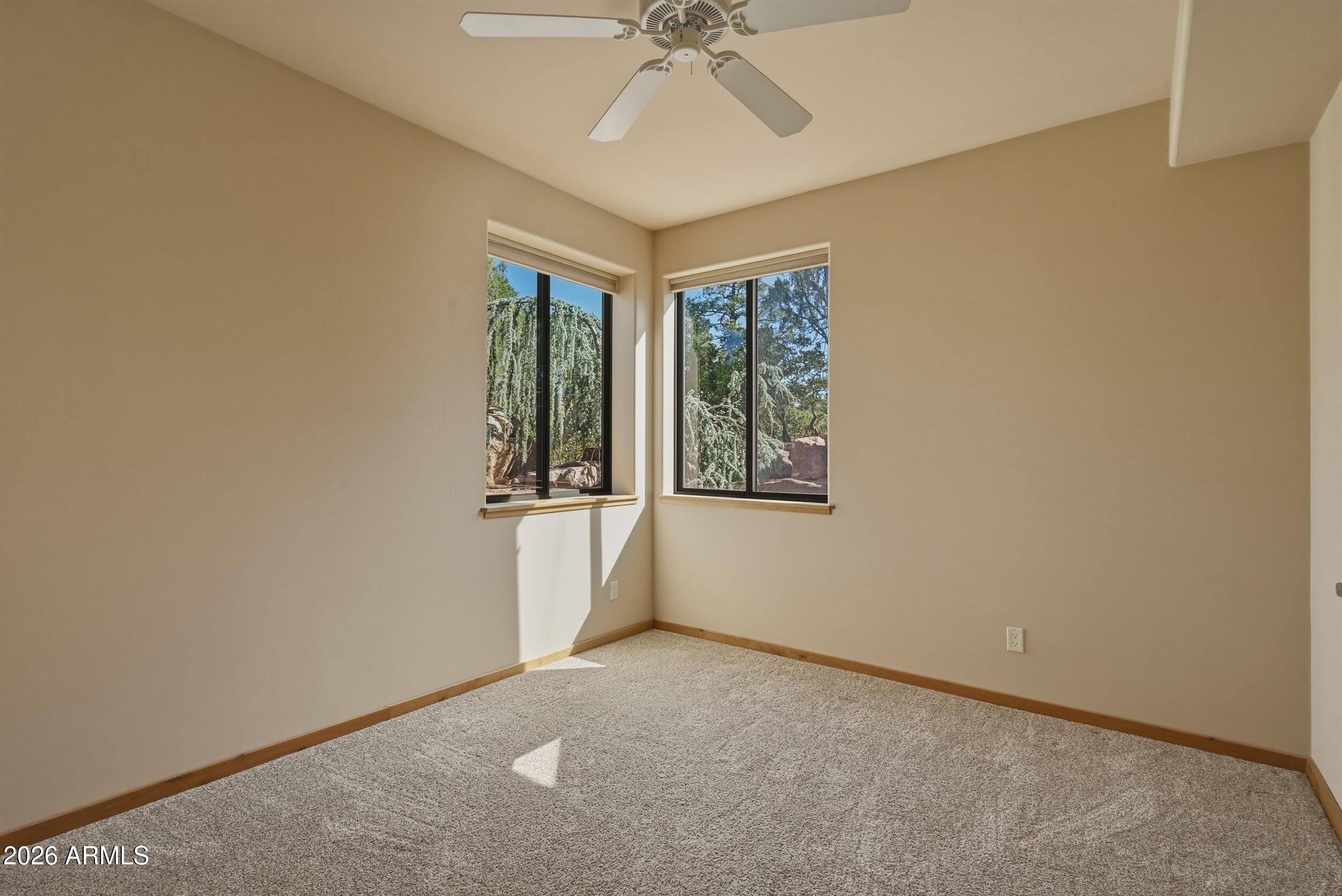 3101 East Mayfield Payson, AZ 85541 - Photo 49 of 71 an empty room with a ceiling fan and a window