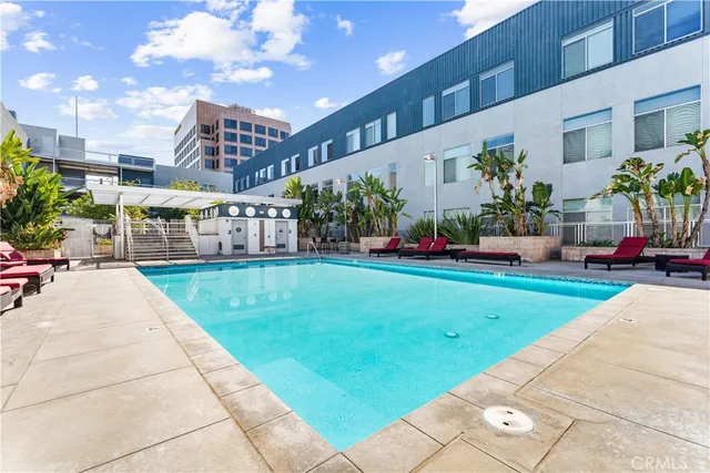a view of a patio with dining table and chairs