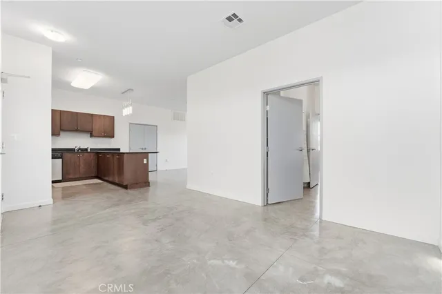 a view of kitchen and kitchen with sink