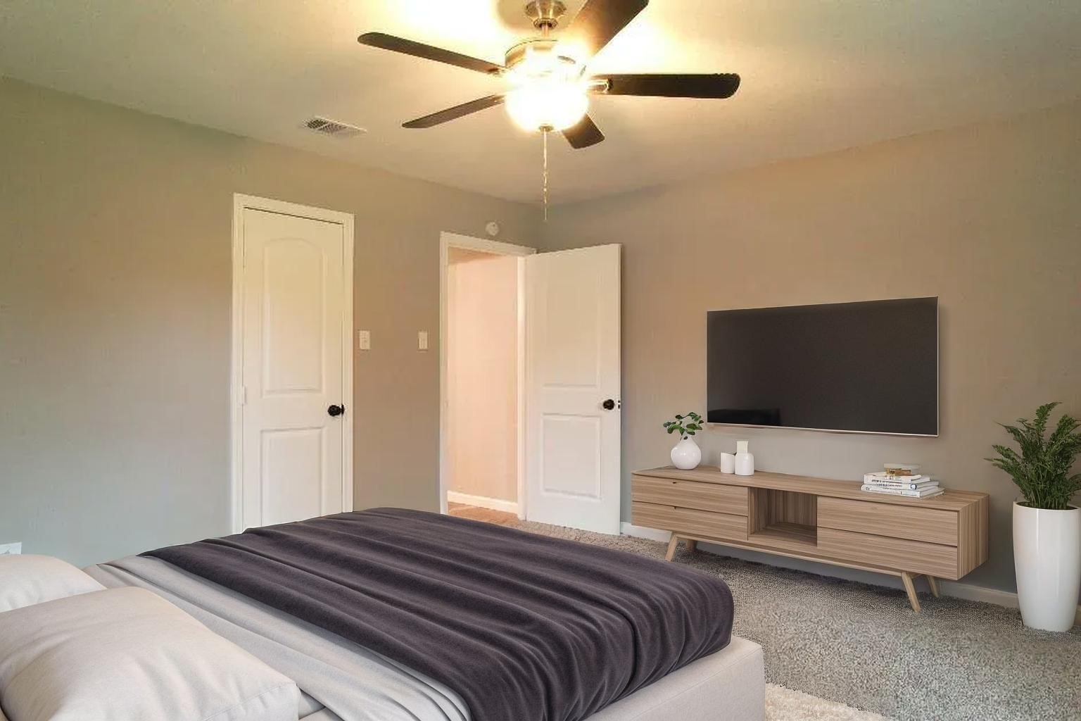 25373 Goodson Road Splendora, TX 77372 - Photo 20 of 41 a bedroom with a bed and a flat screen tv