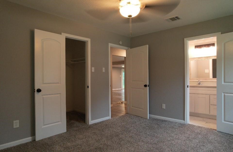 25373 Goodson Road Splendora, TX 77372 - Photo 29 of 41 an empty room with chandelier fan