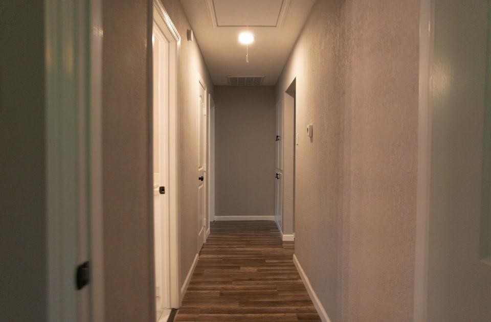 25373 Goodson Road Splendora, TX 77372 - Photo 30 of 41 a view of a hallway with wooden floor