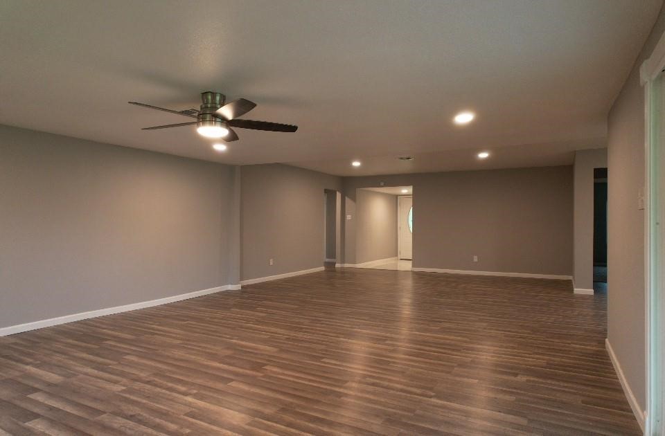 25373 Goodson Road Splendora, TX 77372 - Photo 7 of 41 a view of an empty room with wooden floor