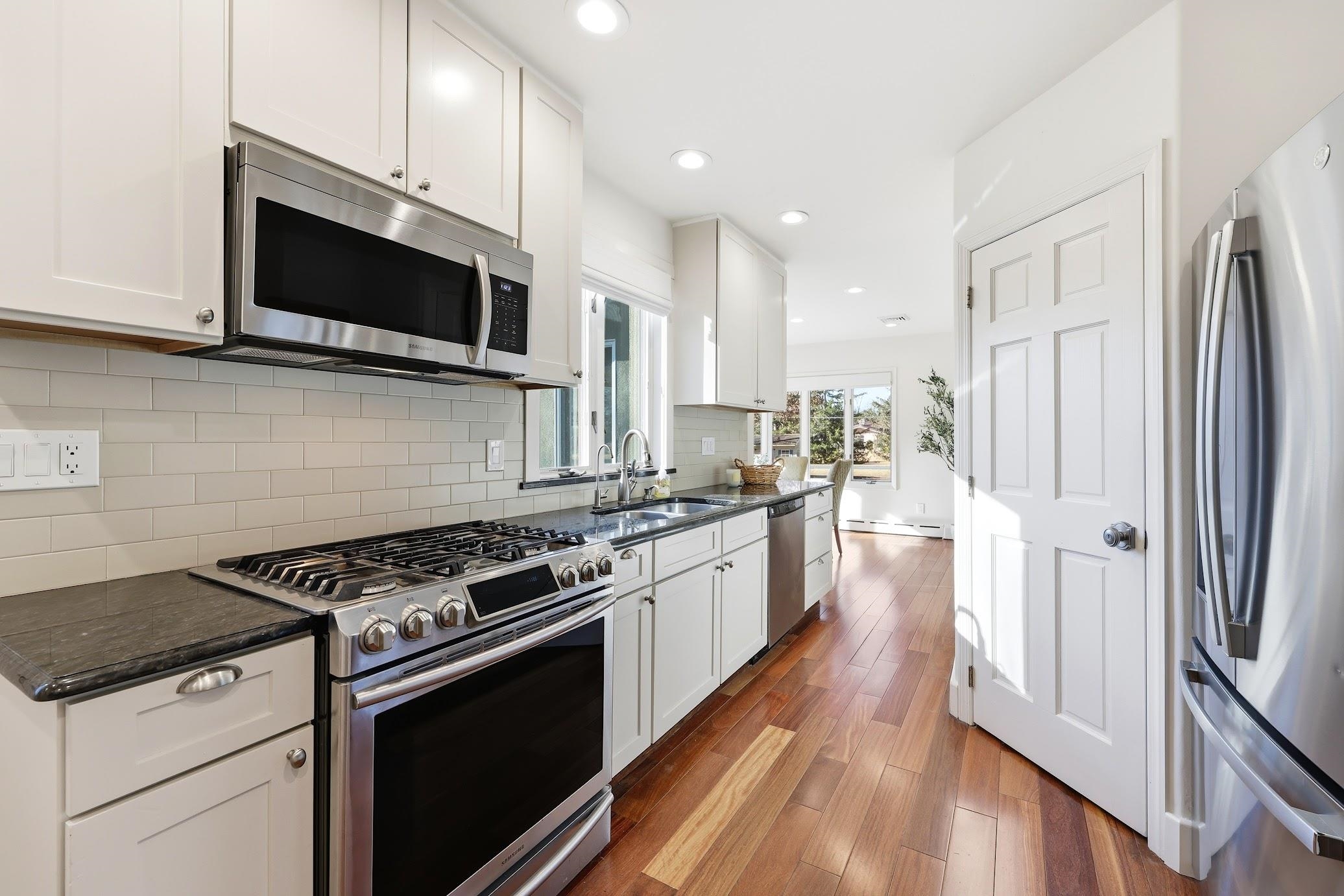 862 Central Hammonton, NJ 08037 - Photo 21 of 46 a kitchen with stainless steel appliances a sink a stove top oven a refrigerator and cabinets
