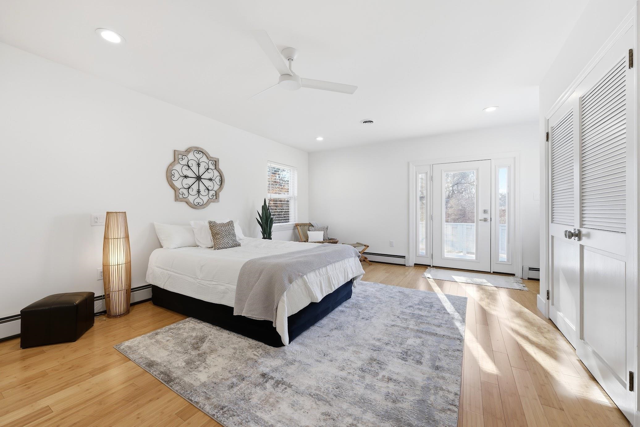 862 Central Hammonton, NJ 08037 - Photo 25 of 46 a spacious bedroom with a bed and a lamp