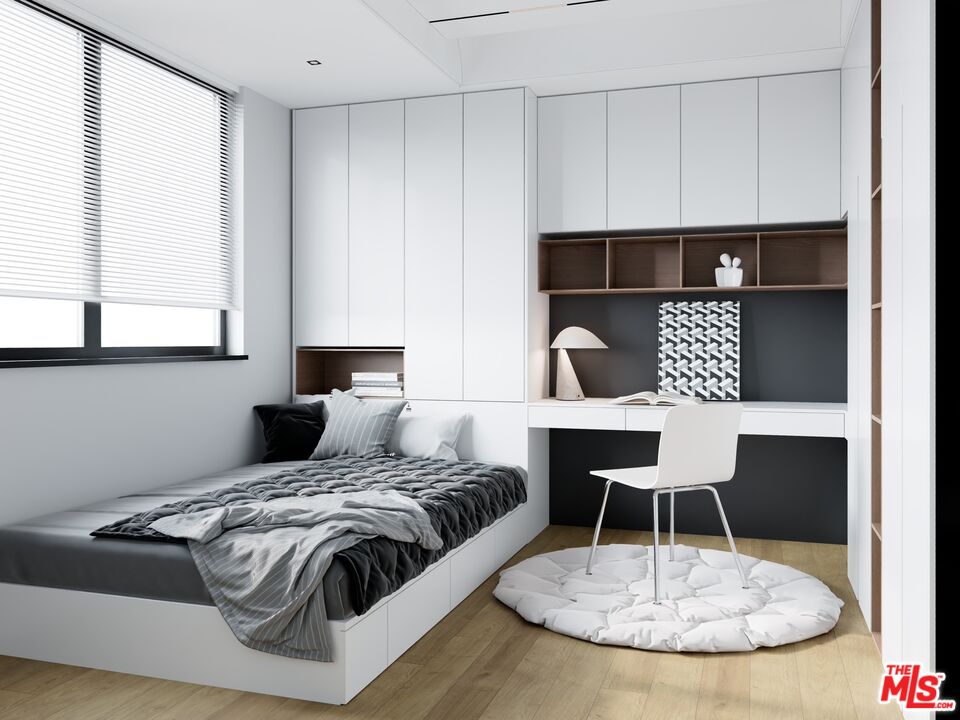 448 Beech Street Los Angeles, CA 90065 - Photo 12 of 31 a bedroom with a bed a table and chair