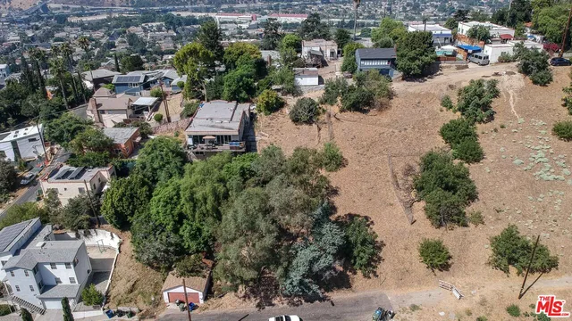an aerial view of a city with lots of residential buildings