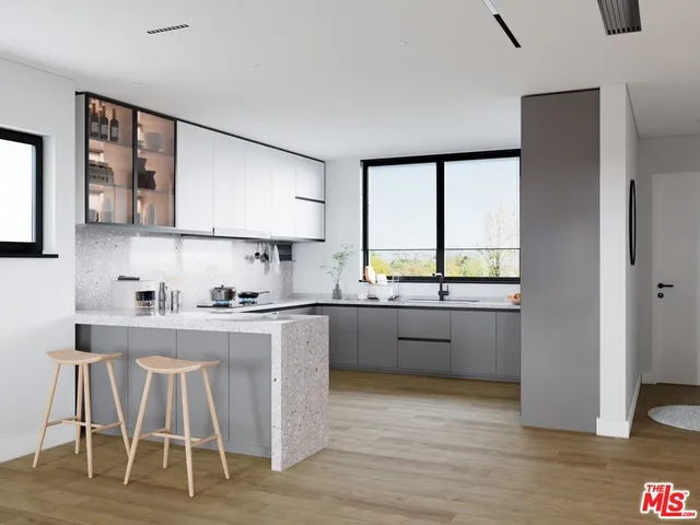 a kitchen with wooden floors and white appliances