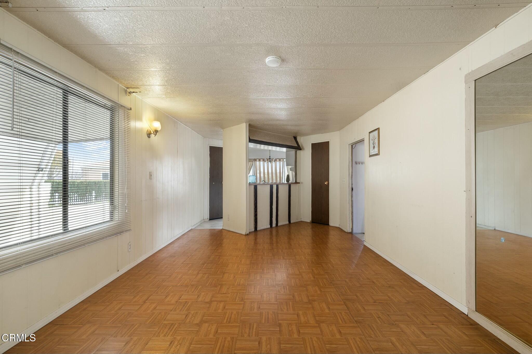 1853 Ives Avenue, Unit 51 Oxnard, CA 93033 - Photo 11 of 38 a view of an empty room with a window