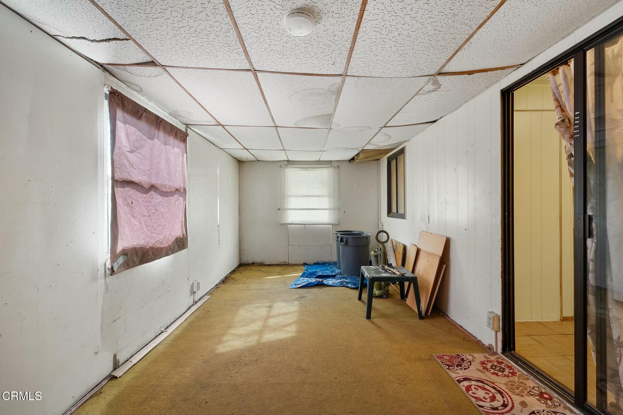 1853 Ives Avenue, Unit 51 Oxnard, CA 93033 - Photo 20 of 38 a view of a room with furniture wooden floor and window