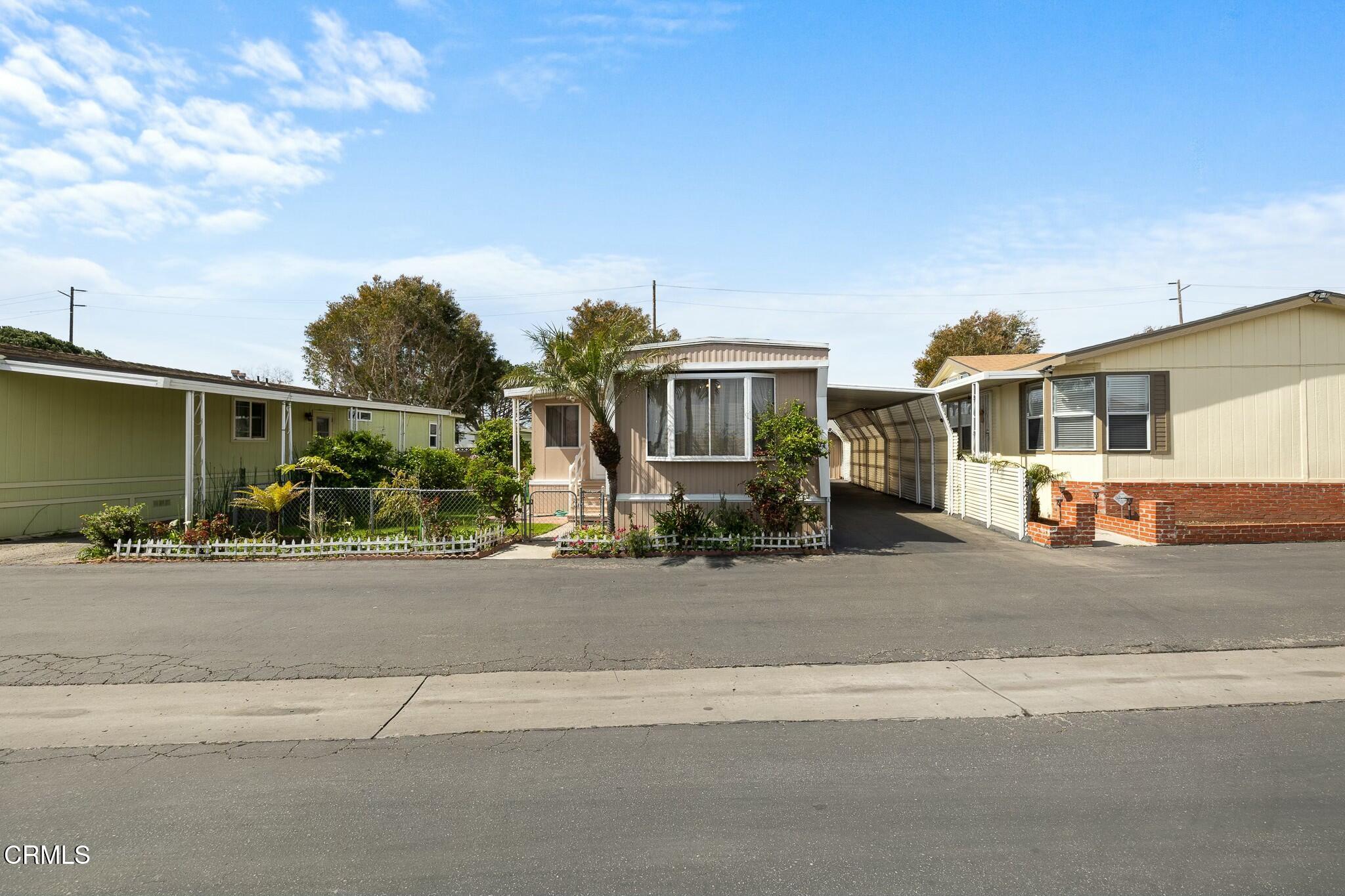 1853 Ives Avenue, Unit 51 Oxnard, CA 93033 - Photo 2 of 38 a view of a house with a street
