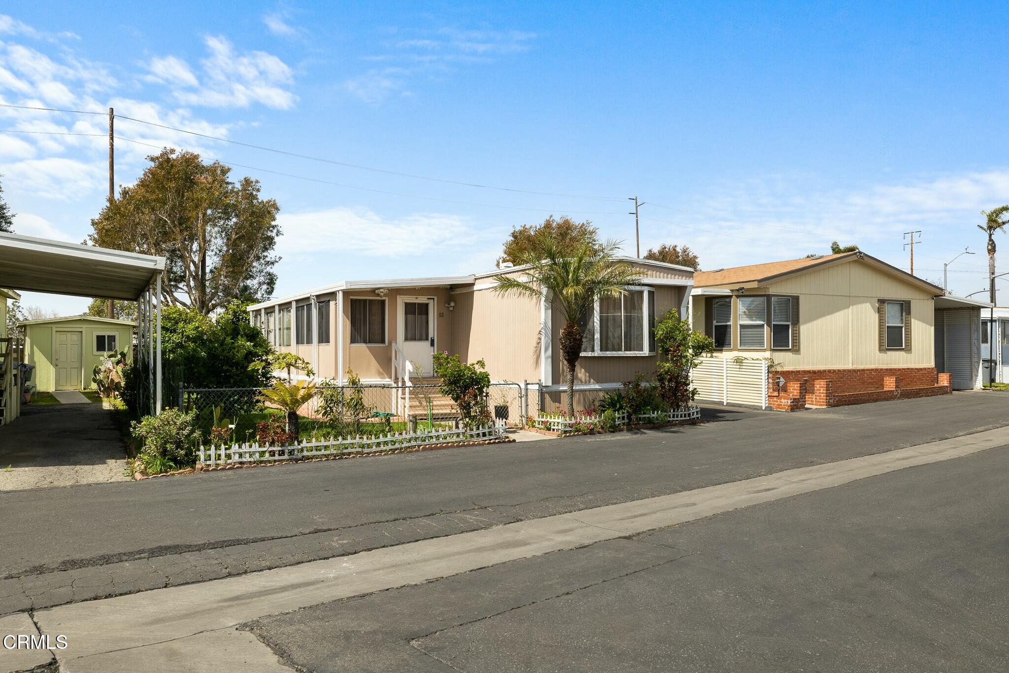 1853 Ives Avenue, Unit 51 Oxnard, CA 93033 - Photo 3 of 38 front view of a house with a street