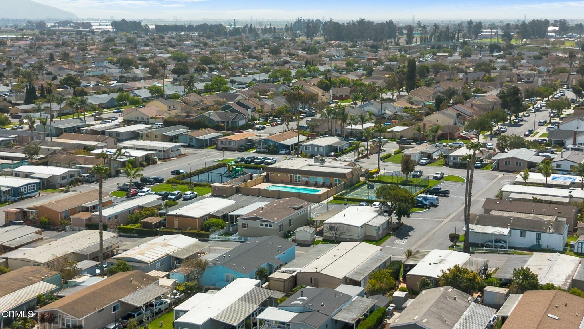 1853 Ives Avenue, Unit 51 Oxnard, CA 93033 - Photo 32 of 38 an aerial view of a city with lots of residential buildings
