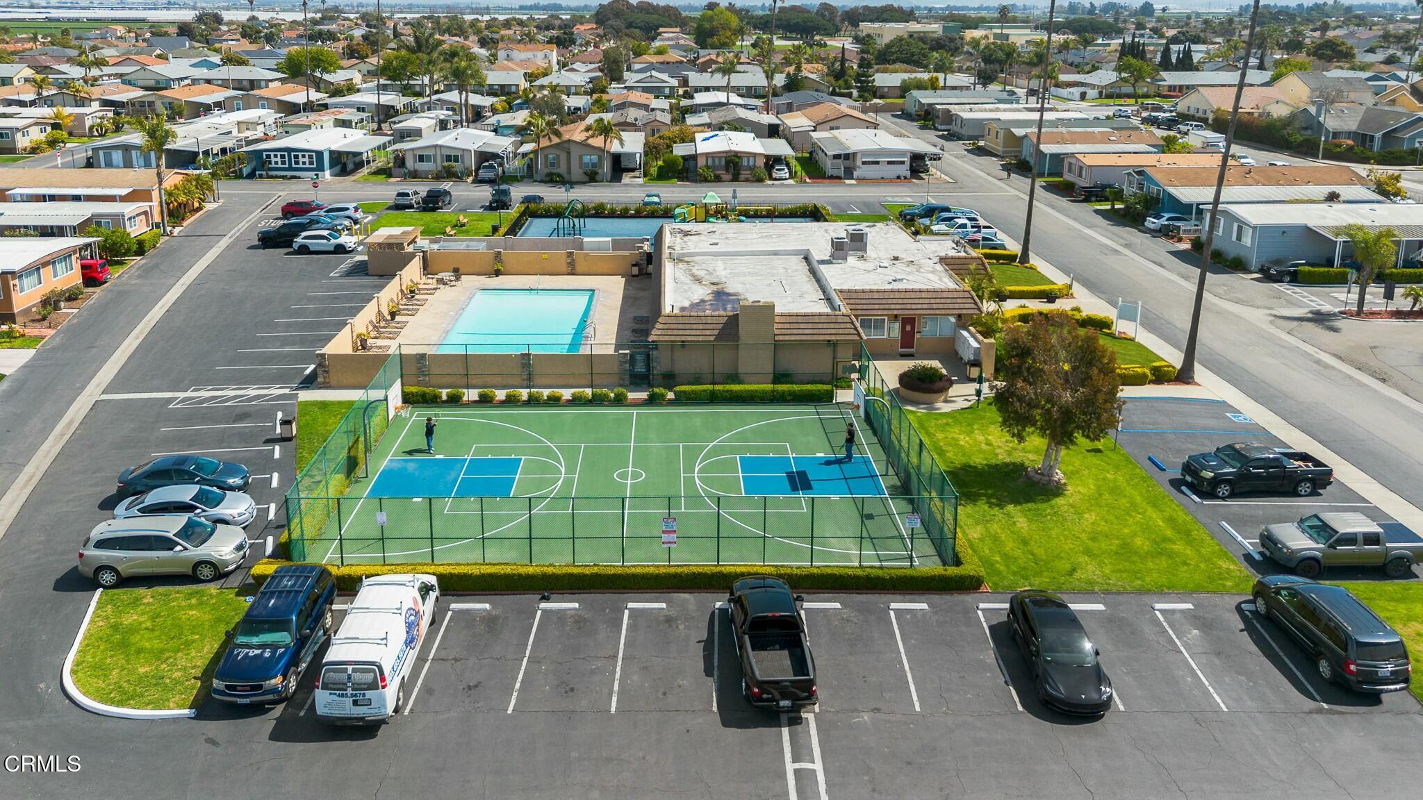 1853 Ives Avenue, Unit 51 Oxnard, CA 93033 - Photo 33 of 38 an aerial view of a yard with swimming pool and outdoor seating