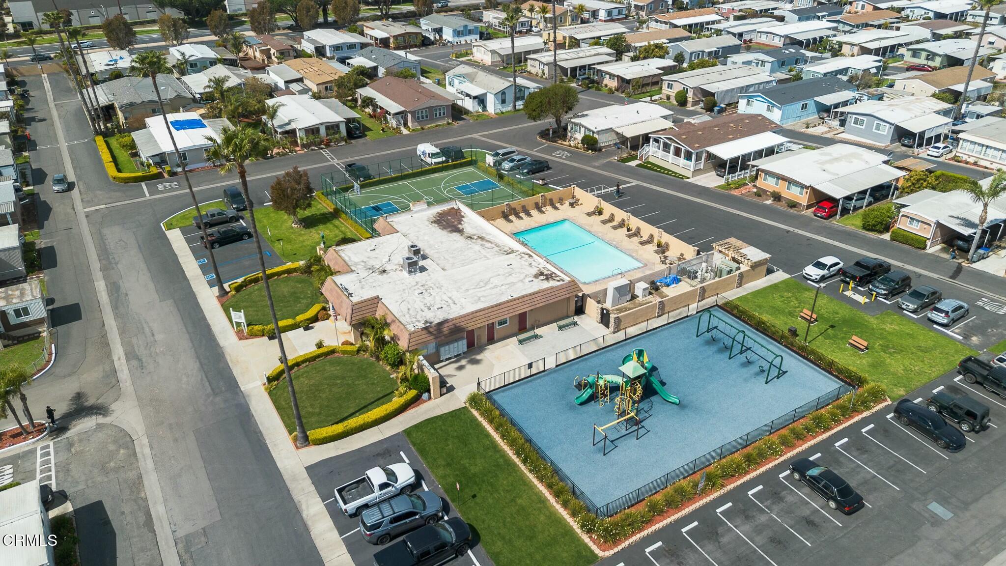 1853 Ives Avenue, Unit 51 Oxnard, CA 93033 - Photo 37 of 38 an aerial view of a pool and outdoor space
