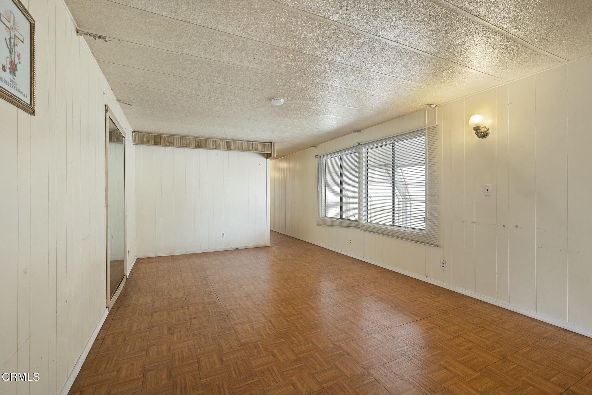 1853 Ives Avenue, Unit 51 Oxnard, CA 93033 - Photo 8 of 38 a view of an empty room with a window