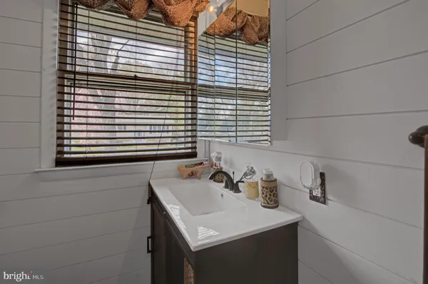 a bathroom with a sink and a vanity