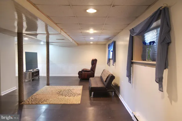a living room with furniture and a rug