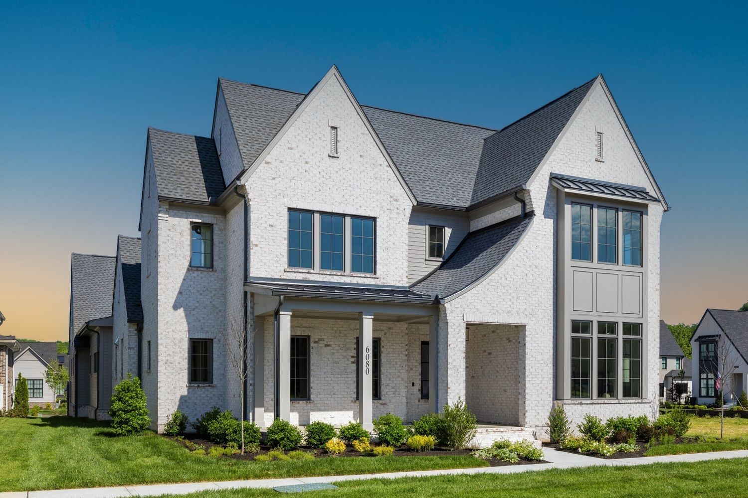 a view of white house with a yard