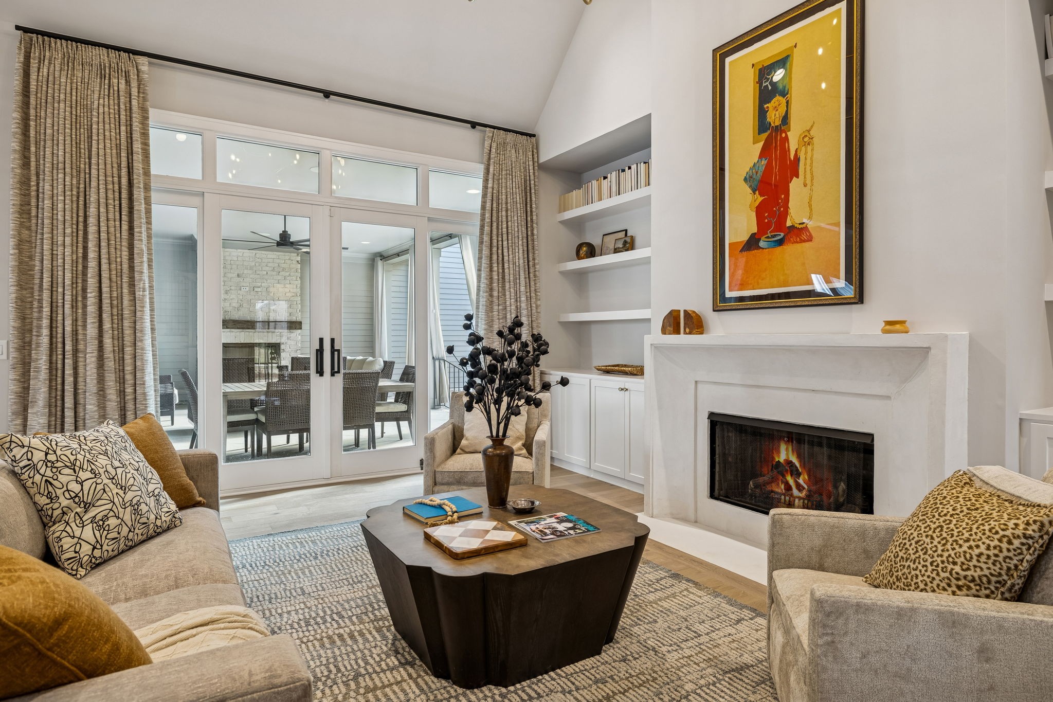 6080 Pasquo Road Nashville, TN 37221 - Photo 16 of 76 a living room with furniture a fireplace and a large window