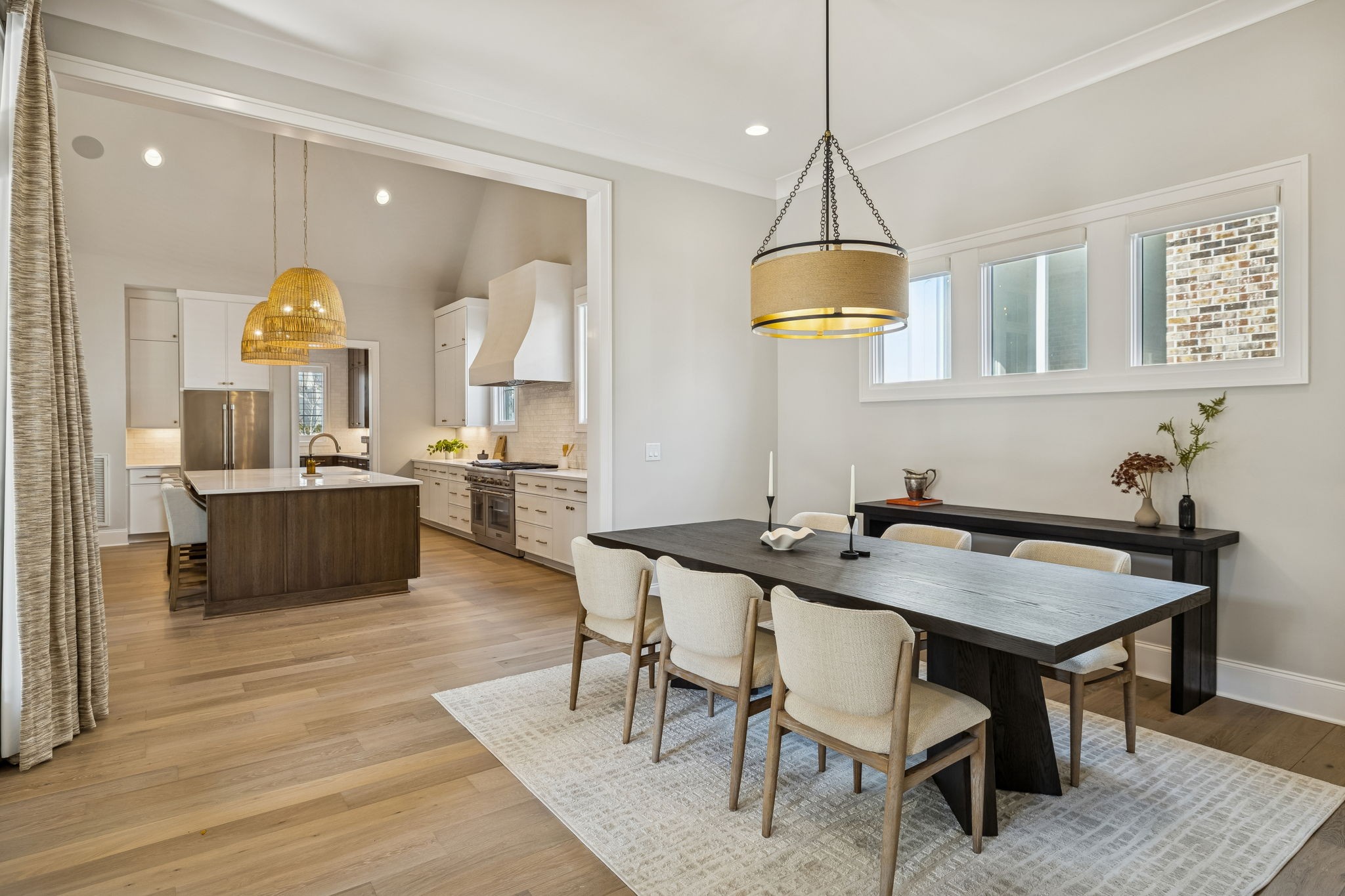 6080 Pasquo Road Nashville, TN 37221 - Photo 27 of 76 a view of a a dining room and a kitchen with a table chairs
