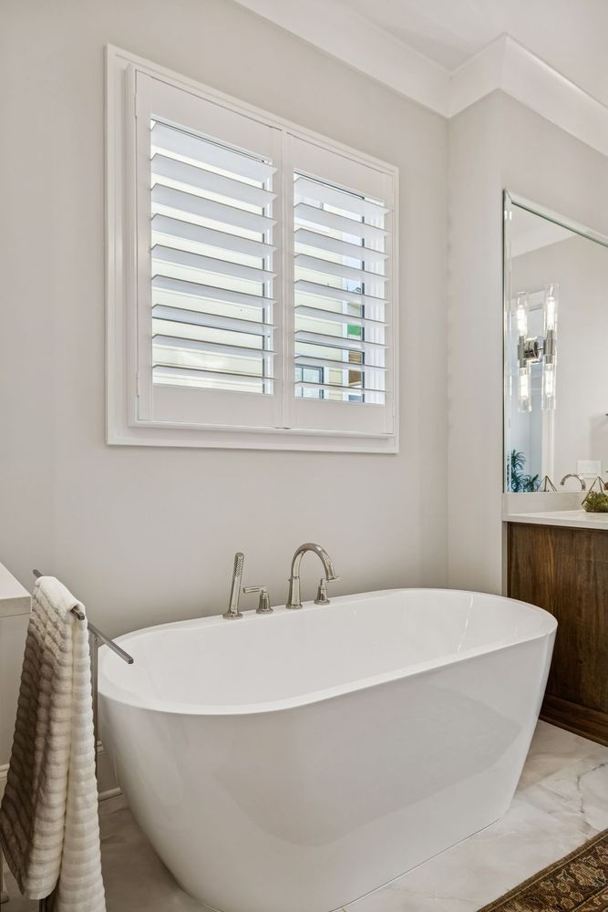 6080 Pasquo Road Nashville, TN 37221 - Photo 36 of 76 a white bath tub sitting next to a window