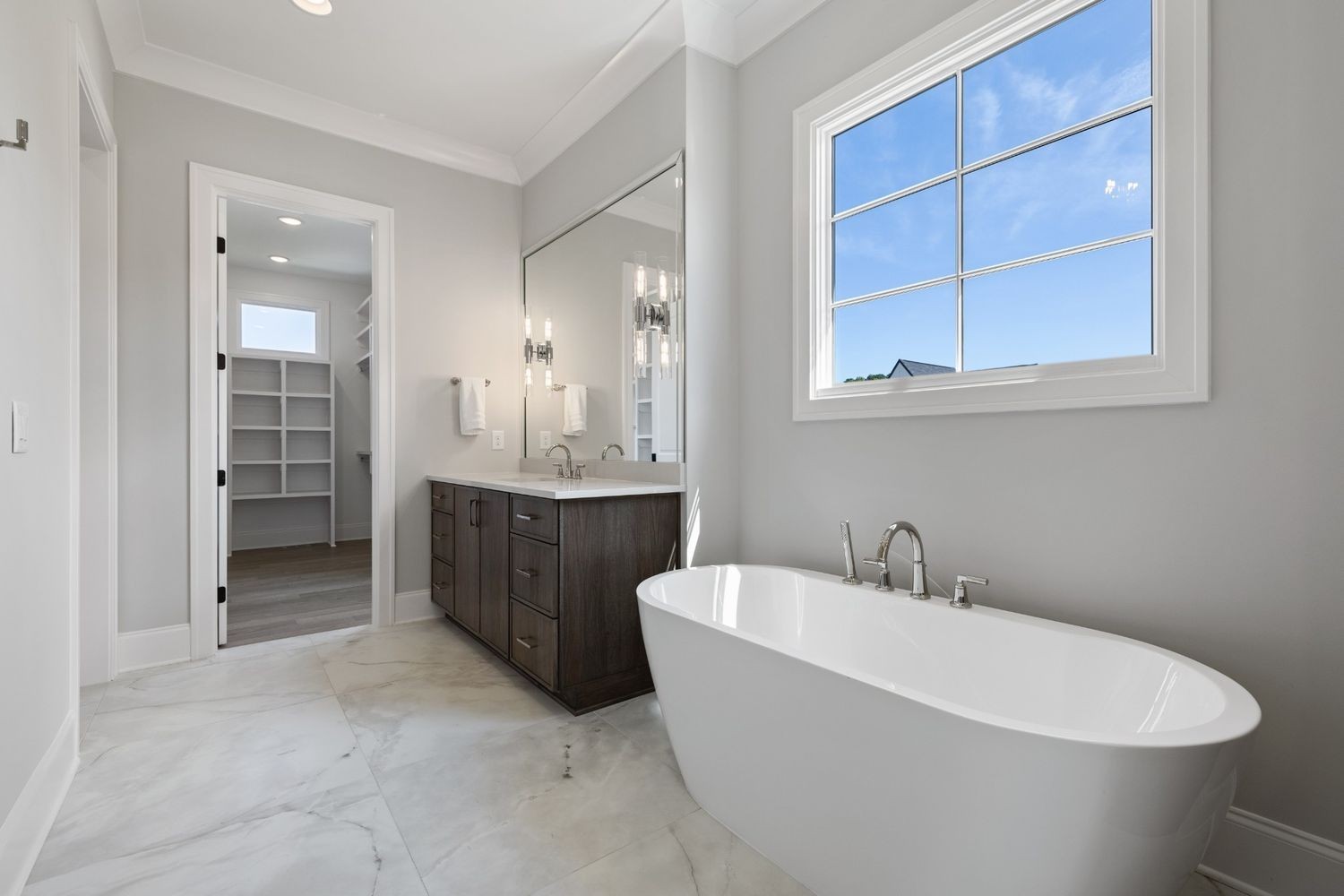 6080 Pasquo Road Nashville, TN 37221 - Photo 38 of 76 a white bath tub sitting in a bathroom