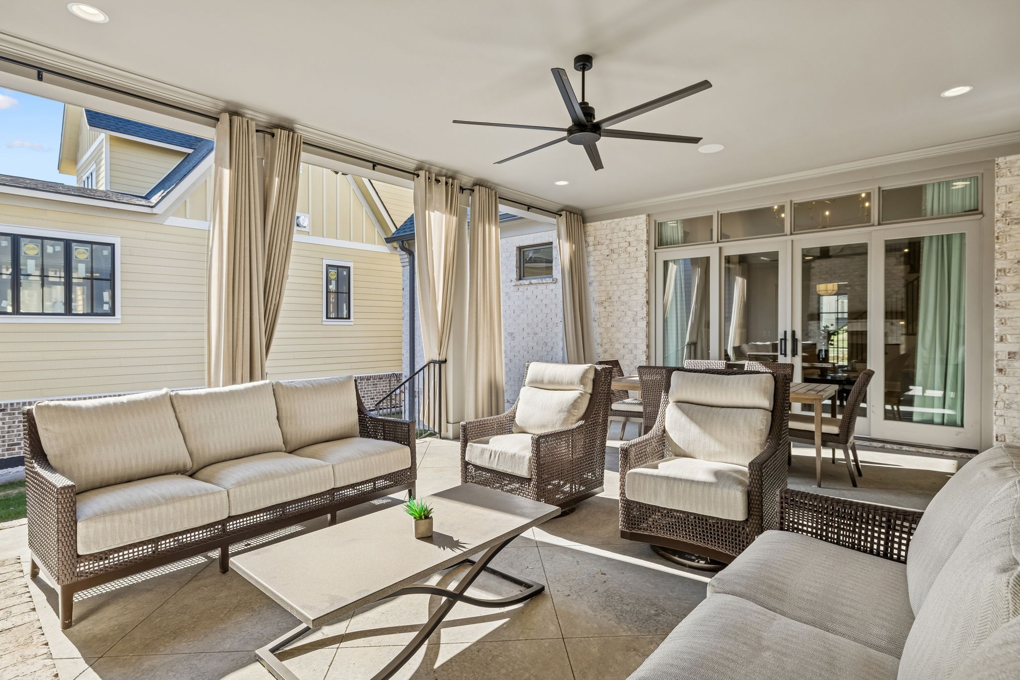 6080 Pasquo Road Nashville, TN 37221 - Photo 65 of 76 a living room with furniture a ceiling fan and a window