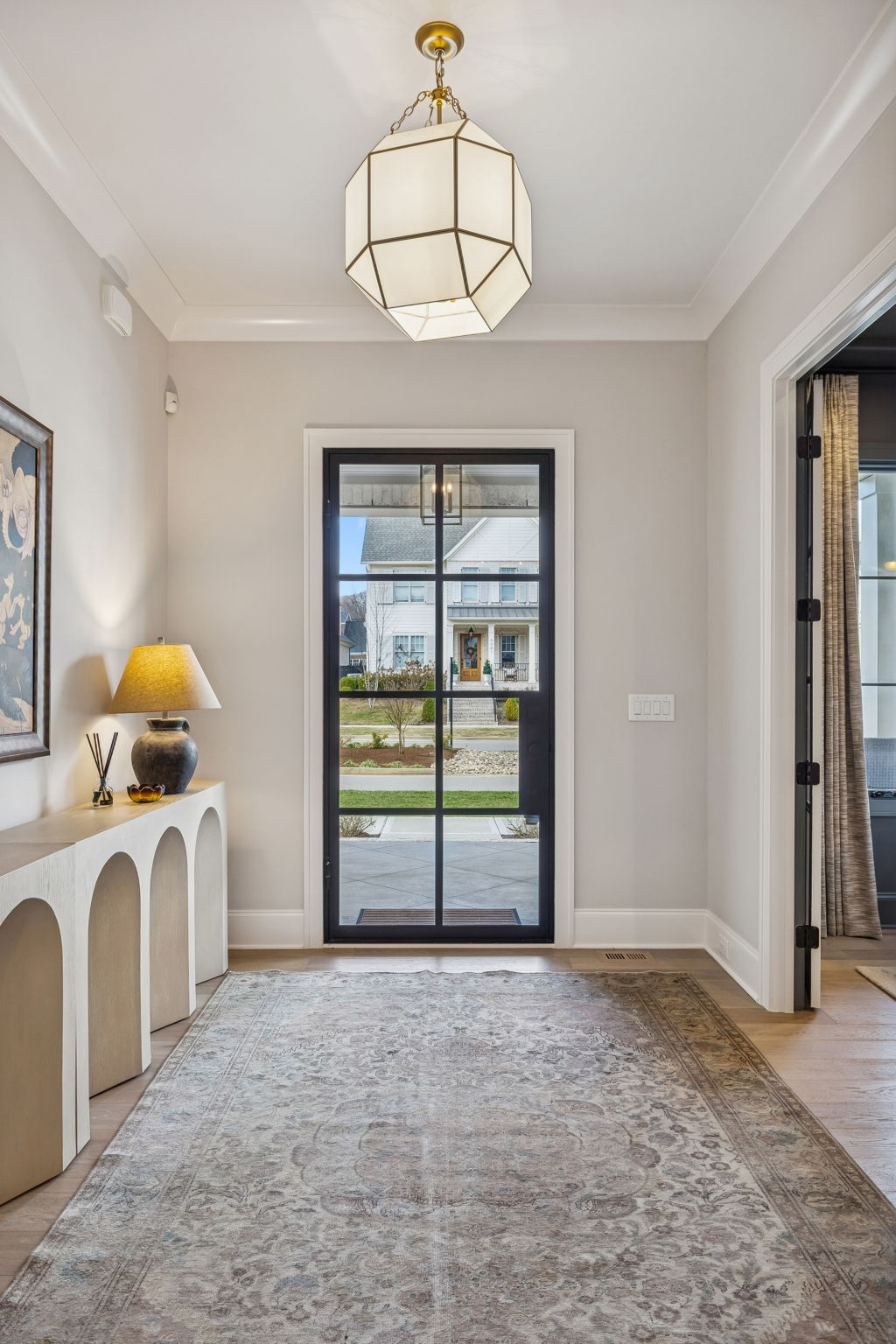 6080 Pasquo Road Nashville, TN 37221 - Photo 7 of 76 a view of a livingroom with a chandelier and a window