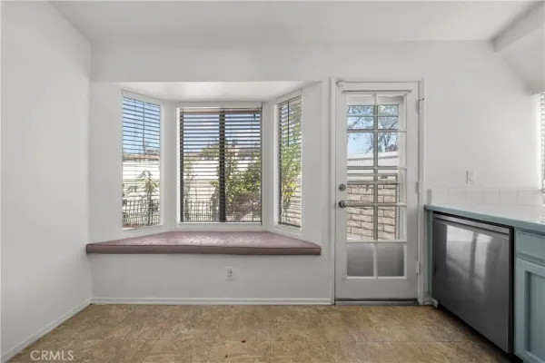 an empty room with large window