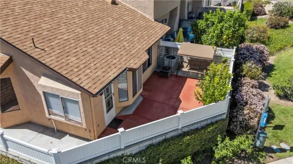 an aerial view of a house with balcony and garage
