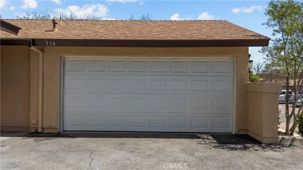 a backyard of a house with outdoor seating