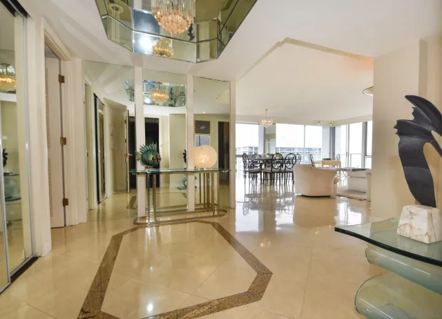 a view of a living room and chandelier