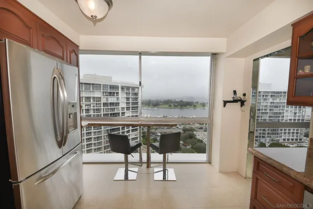 a kitchen with a refrigerator a stove and a sink