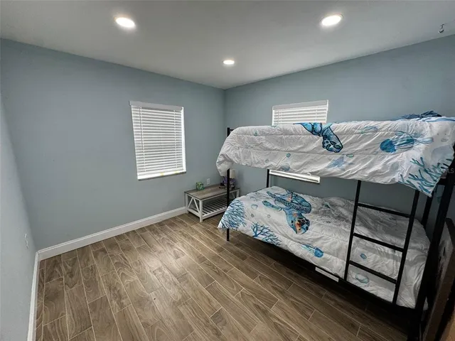 a bedroom with a bed and a dresser