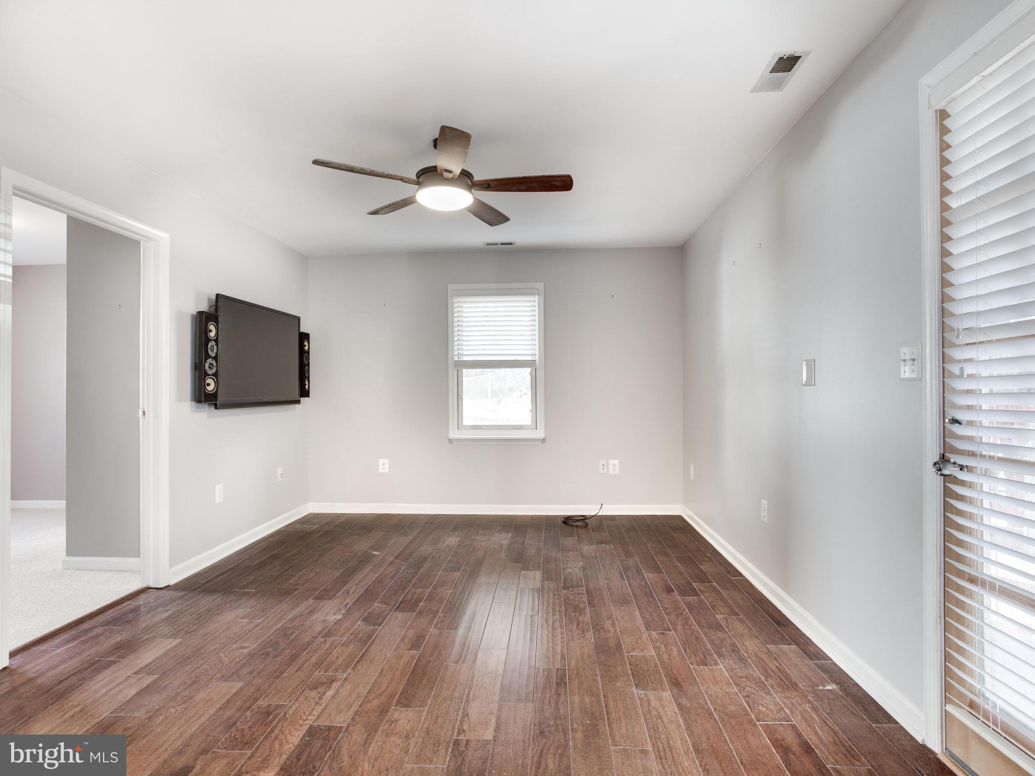 1240-7 Seven Oaks Road Baltimore, MD 21227 - Photo 8 of 23 Family Room with Door to Deck