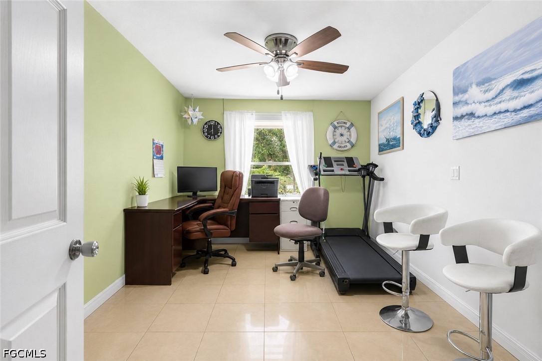 18 Illinois Road Lehigh Acres, FL 33936 - Photo 45 of 45 a work room with furniture and a large window