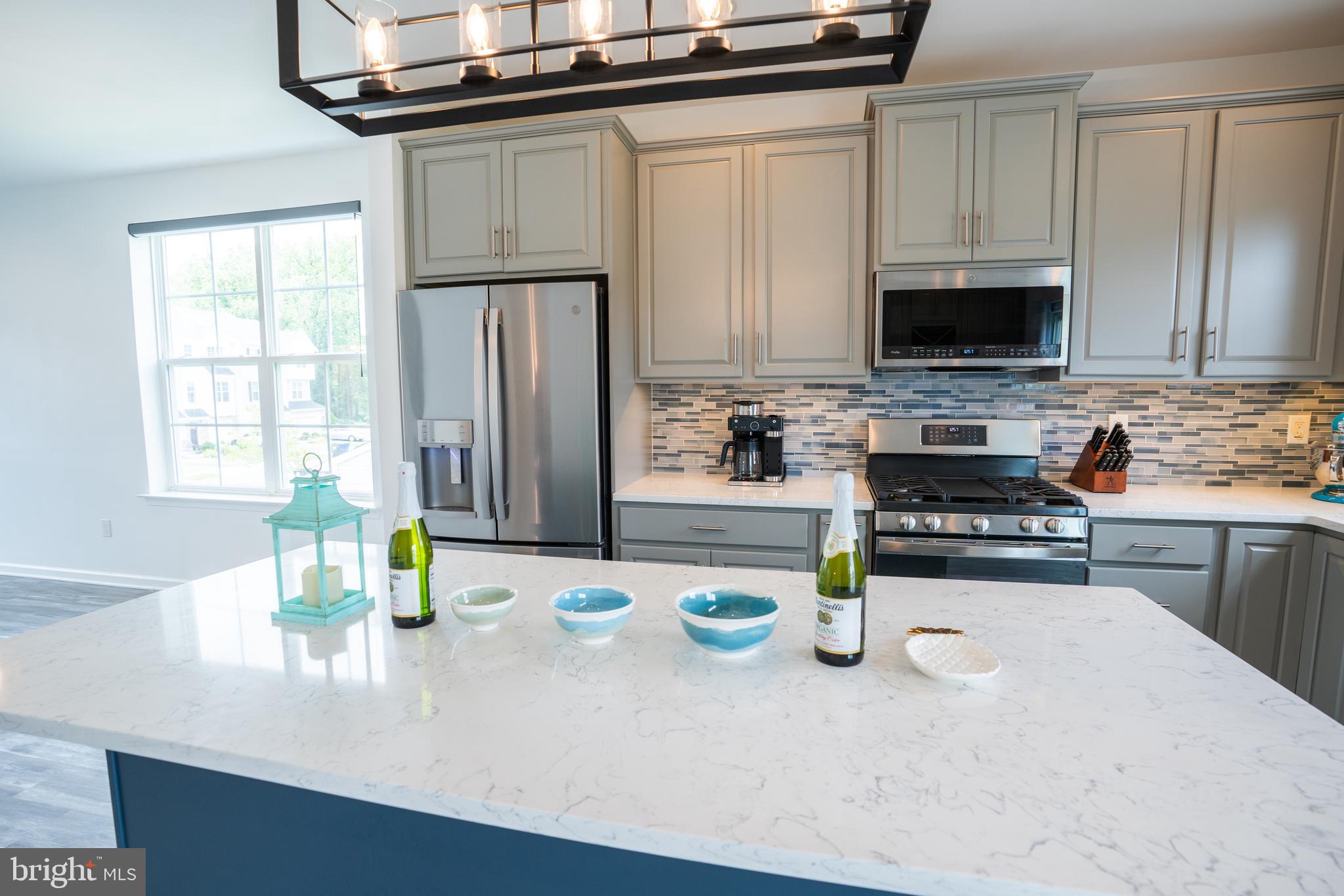 46 Aviary Road Thorofare, NJ 08086 - Photo 13 of 31 a kitchen with a sink a stove and a microwave
