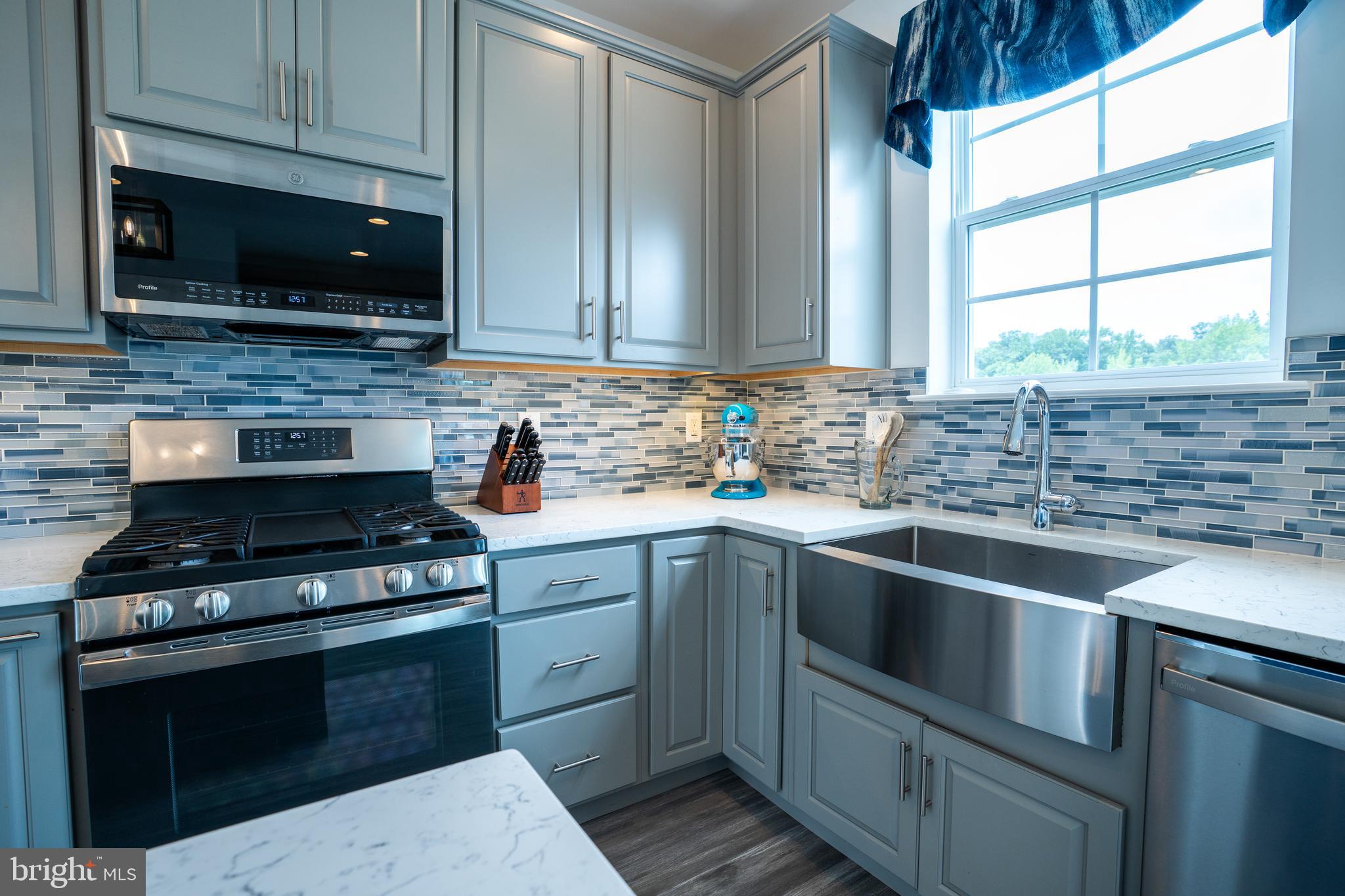 46 Aviary Road Thorofare, NJ 08086 - Photo 14 of 31 a kitchen with stainless steel appliances a stove sink and microwave