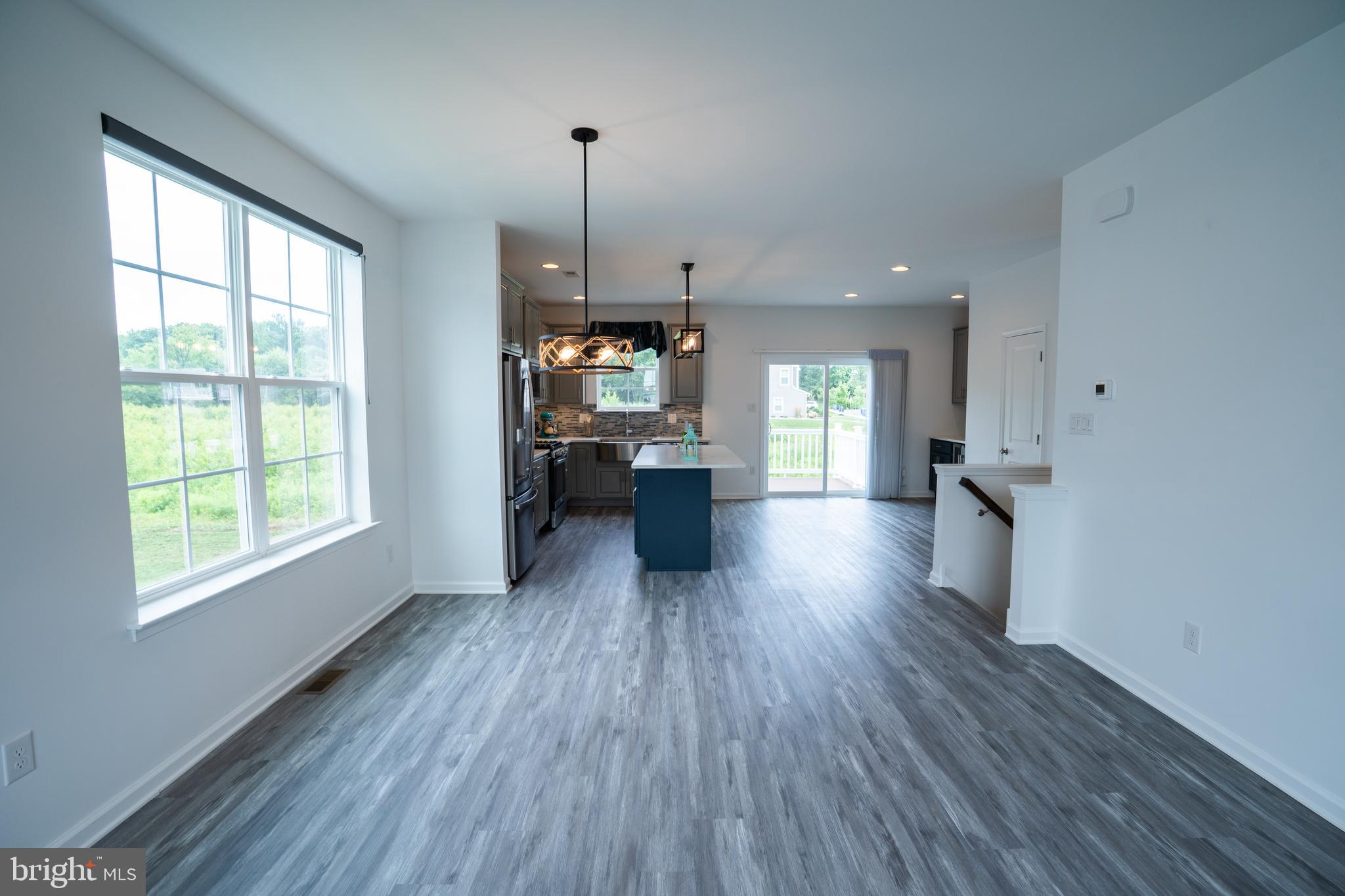 46 Aviary Road Thorofare, NJ 08086 - Photo 15 of 31 a open kitchen with white cabinets and wooden floor
