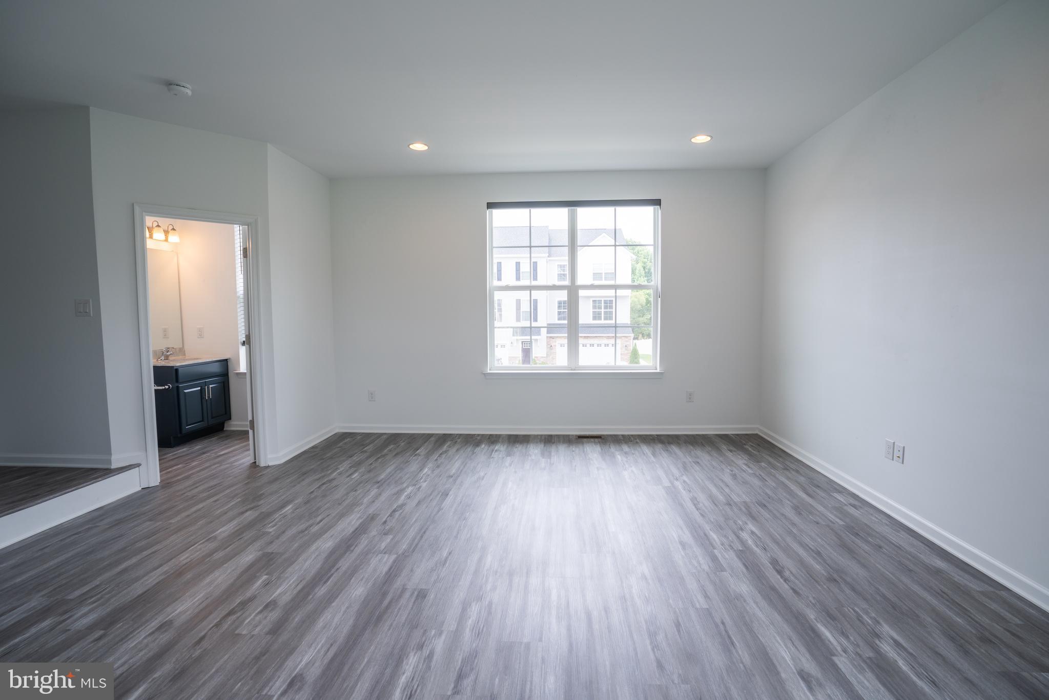 46 Aviary Road Thorofare, NJ 08086 - Photo 16 of 31 an empty room with wooden floor and windows