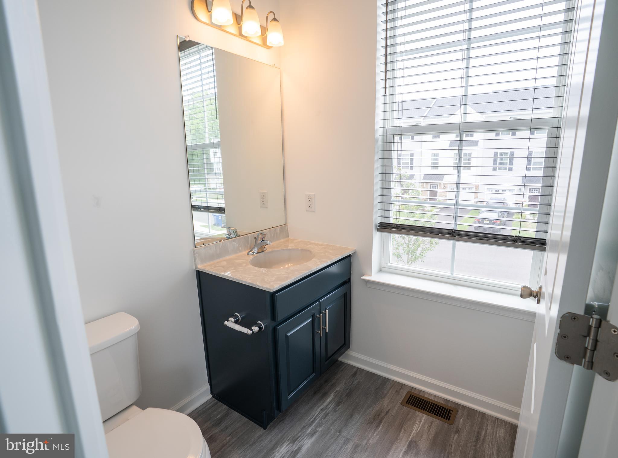 46 Aviary Road Thorofare, NJ 08086 - Photo 18 of 31 a bathroom with a sink toilet and vanity