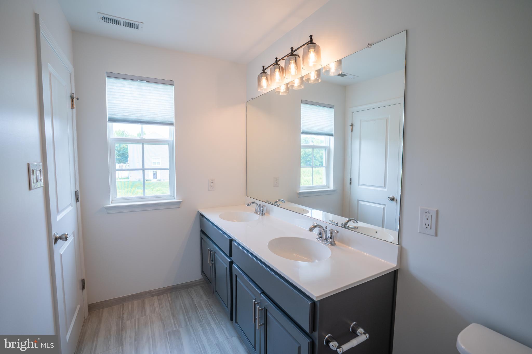 46 Aviary Road Thorofare, NJ 08086 - Photo 22 of 31 a bathroom with a sink and a mirror