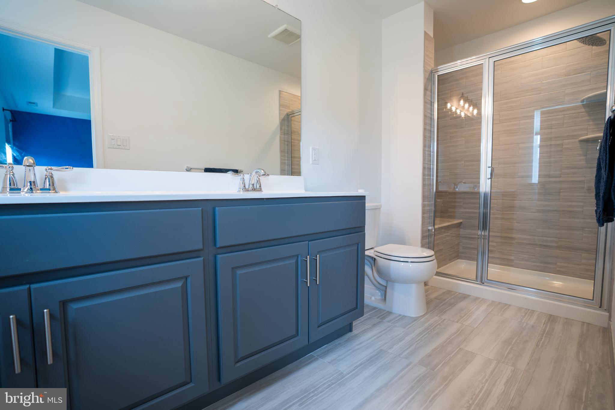 46 Aviary Road Thorofare, NJ 08086 - Photo 23 of 31 a bathroom with a toilet a sink and glass door