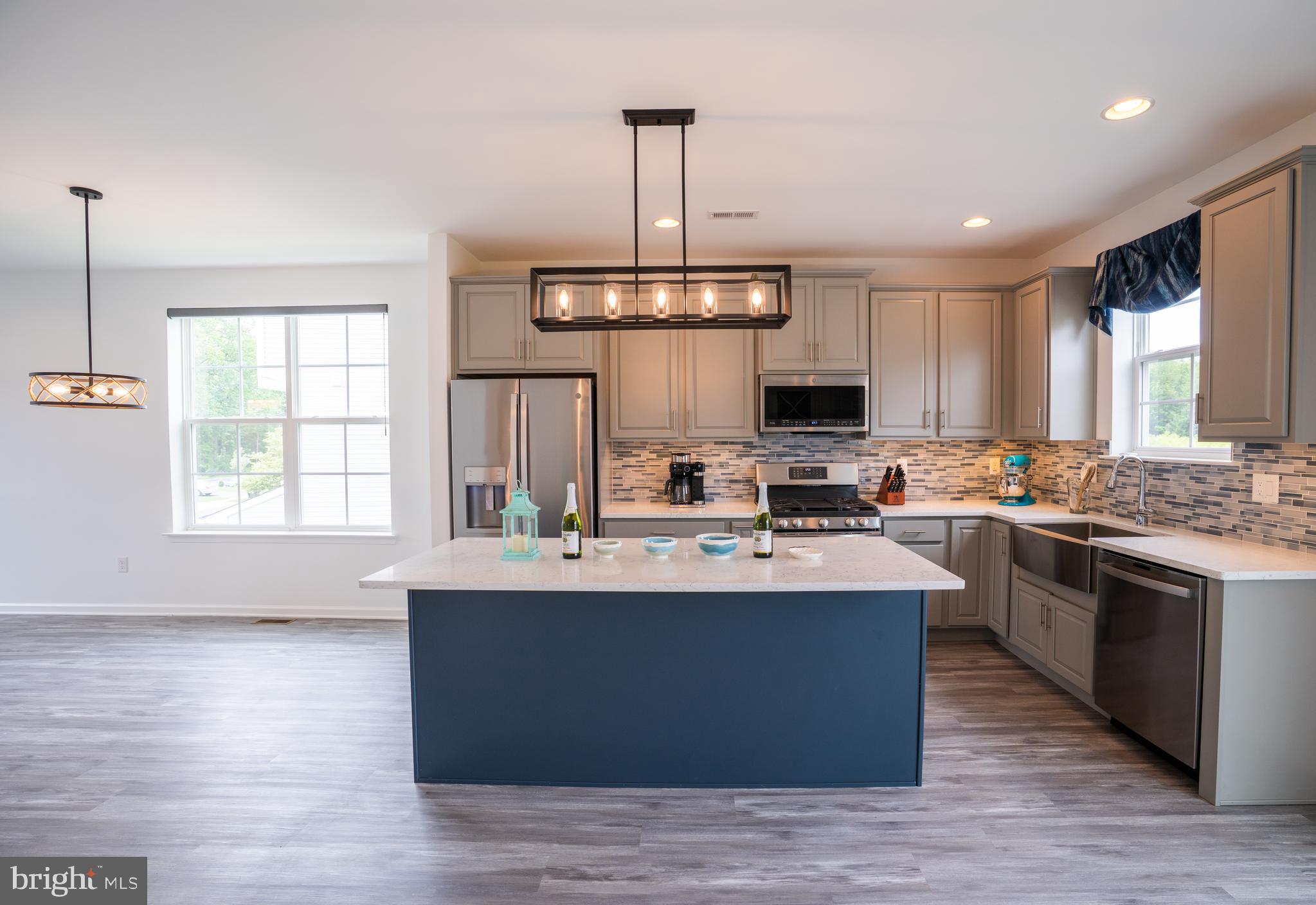 46 Aviary Road Thorofare, NJ 08086 - Photo 10 of 31 a large kitchen with stainless steel appliances granite countertop a stove and a wooden floors