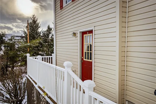 a view of a house with wooden fence