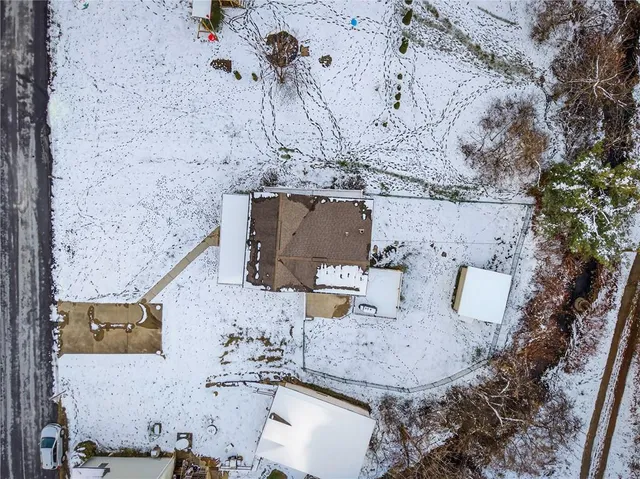 an aerial view of residential houses with outdoor space