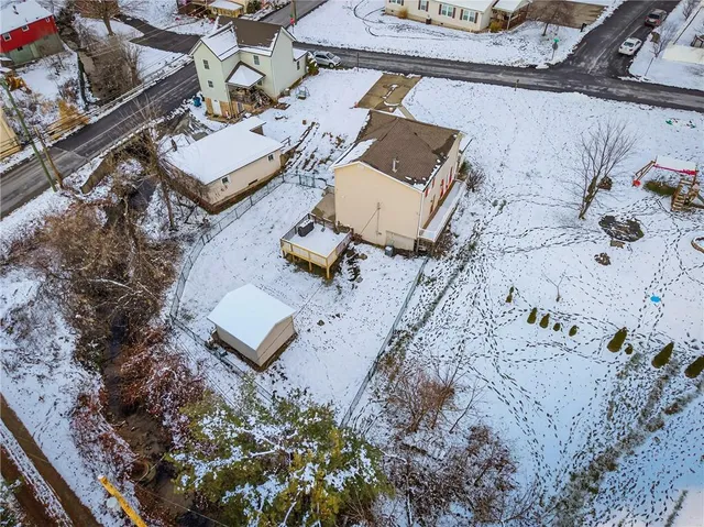 an aerial view of residential house with outdoor space